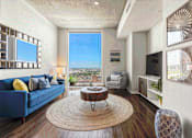 Thumbnail 8 of 114 - Bright, open living area with contemporary décor and natural light at Med Center in Houston, TX.