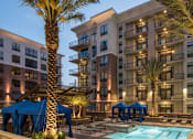 Thumbnail 2 of 61 - Exterior and Pool at Dusk