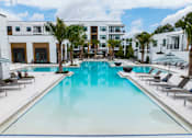 Thumbnail 30 of 47 - Lounge Chairs by the Pool at The Residences at Enso, Jacksonville, FL