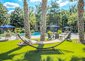 Thumbnail 5 of 50 - Harbor Cove Apartments Courtyard with Hammock