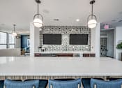 Thumbnail 18 of 61 - Skylounge with Epicurean Kitchen, Bistro Seating and Exquisite Views of Downtown