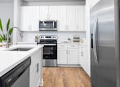 Thumbnail 1 of 47 - Kitchen with Stainless-Steel Appliances at The Residences at Enso, Jacksonville, Florida