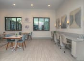 Thumbnail 6 of 40 - a dining room with a table and chairs