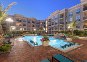Thumbnail 13 of 31 - Pool with Sundeck and Lounge Seating