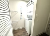 Thumbnail 20 of 46 - a small kitchen with a stove and a refrigerator