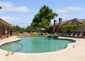 Thumbnail 25 of 35 - the preserve at ballantyne commons community swimming pool with chairs and building with trees