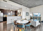 Thumbnail 7 of 114 - Open kitchen with a breakfast bar for casual dining & modern appliances at Med Center, Houston, TX.