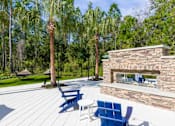 Thumbnail 36 of 59 - Longleaf at St. Johns Apartments | St. Johns, FL | Outdoor Fireplace