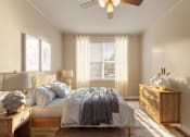Thumbnail 12 of 13 - A bedroom with a bed, nightstand, and a ceiling fan.