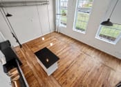 Thumbnail 19 of 22 - Kitchen and living room at Spinning Mill Lofts, Clayton, NC 27520