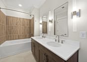 Thumbnail 32 of 63 - A bathroom with a white sink and a wooden wall.