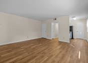 Thumbnail 3 of 10 - the living room and dining room of an apartment with wood flooring