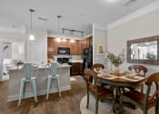 Thumbnail 3 of 13 - kitchen and dining room at The Arbors at East Village, Clayton, NC, 27527
