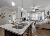 Thumbnail 4 of 13 - kitchen counter with a sink at The Arbors at East Village, Clayton, NC, 27527