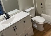 Thumbnail 6 of 13 - Bathroom With Bathtub at Granville Oaks Apartment Homes, Creedmoor, NC 27522