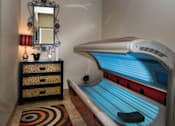 Thumbnail 5 of 14 - a small room with a tanning bed