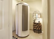 Thumbnail 12 of 13 - A white and silver steamer in a bathroom.