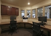 Thumbnail 7 of 13 - A room with two chairs and two monitors.