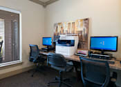 Thumbnail 20 of 21 - A room with two computers and two chairs.