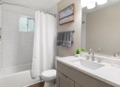 Thumbnail 7 of 18 - Remodeled Bathroom with Granite Countertops