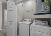 Thumbnail 8 of 27 - a laundry room with a washer and dryer and a refrigerator