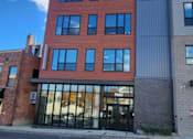 Thumbnail 14 of 14 - A building with the sign "front.com" on the top.