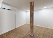 Thumbnail 85 of 96 - A room with a carpeted floor and a wooden pillar.