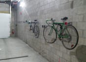 Thumbnail 14 of 36 - Indoor bicycle storage area with wall mounted racks at 68 Beale Apartments, Quincy, MA