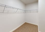 Thumbnail 67 of 96 - A white wall with a metal rack on it.