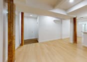 Thumbnail 63 of 96 - A room with wooden floors and white walls.