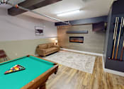 Thumbnail 10 of 12 - A pool table with a green cloth and a billiard cue.