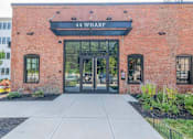 Thumbnail 1 of 53 - The front of a building with the name 44 Wharf on it.