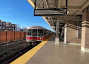 Thumbnail 27 of 36 - Mbta commuter rail train at elevated station platform at 68 Beale Apartments, Quincy, Massachusetts