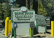 Thumbnail 17 of 18 - A sign for the Tahoe Basin says "Welcome" and has a handicap symbol on it.