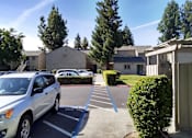 Thumbnail 10 of 19 - Colonial Farms Apartments - view of parking lot with apartment buildings in the background