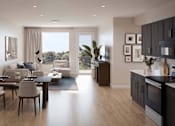 Thumbnail 2 of 6 - A modern kitchen and dining area with a view of the outdoors.
