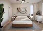 Thumbnail 3 of 6 - A modern bedroom with a large bed and a painting on the wall.