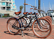 Thumbnail 26 of 34 - A bicycle with a brown seat is parked among other bicycles at Esprit Marina del Rey, 90292