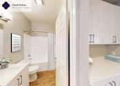 Thumbnail 17 of 39 - A white bathroom with a toilet, sink, and shower at Mission Hills, Camarillo, 93012