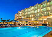 Thumbnail 1 of 34 - A large pool in front of a building with a sign that says at Esprit Marina del Rey, 90292