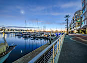 Thumbnail 21 of 34 - A marina with boats docked and a building on the right at Esprit Marina del Rey, 90292