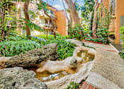Thumbnail 19 of 23 - a small waterfall in the middle of a courtyard  at Casa Granada, Los Angeles, CA