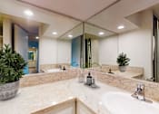 Thumbnail 9 of 23 - a large bathroom with a sink and a mirror at Casa Granada, Los Angeles, CA