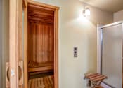 Thumbnail 12 of 17 - a sauna room with a shower and a wooden bench at Valley Plaza Villages, California, 94566