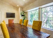 Thumbnail 17 of 17 - a dining room with a large window and a wooden table