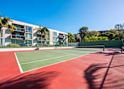 Thumbnail 31 of 36 - a tennis court with apartments in the background  at Marina Harbor, California, 90292