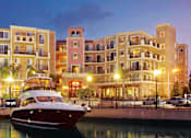 Thumbnail 35 of 36 - a boat is docked in the water in front of some buildings  at Marina Harbor, Marina del Rey