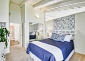Thumbnail 8 of 14 - a bedroom with a large bed and a closet at Mediterranean Village Costa Mesa, Costa Mesa, CA, 92626