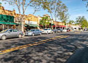 Thumbnail 12 of 12 - a row of cars parked on the side of a street  at Pleasanton Place, Pleasanton, CA, 94566