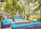 Thumbnail 5 of 13 - a lounge area with blue couches and a fire pit  at Rancho Los Feliz, California
